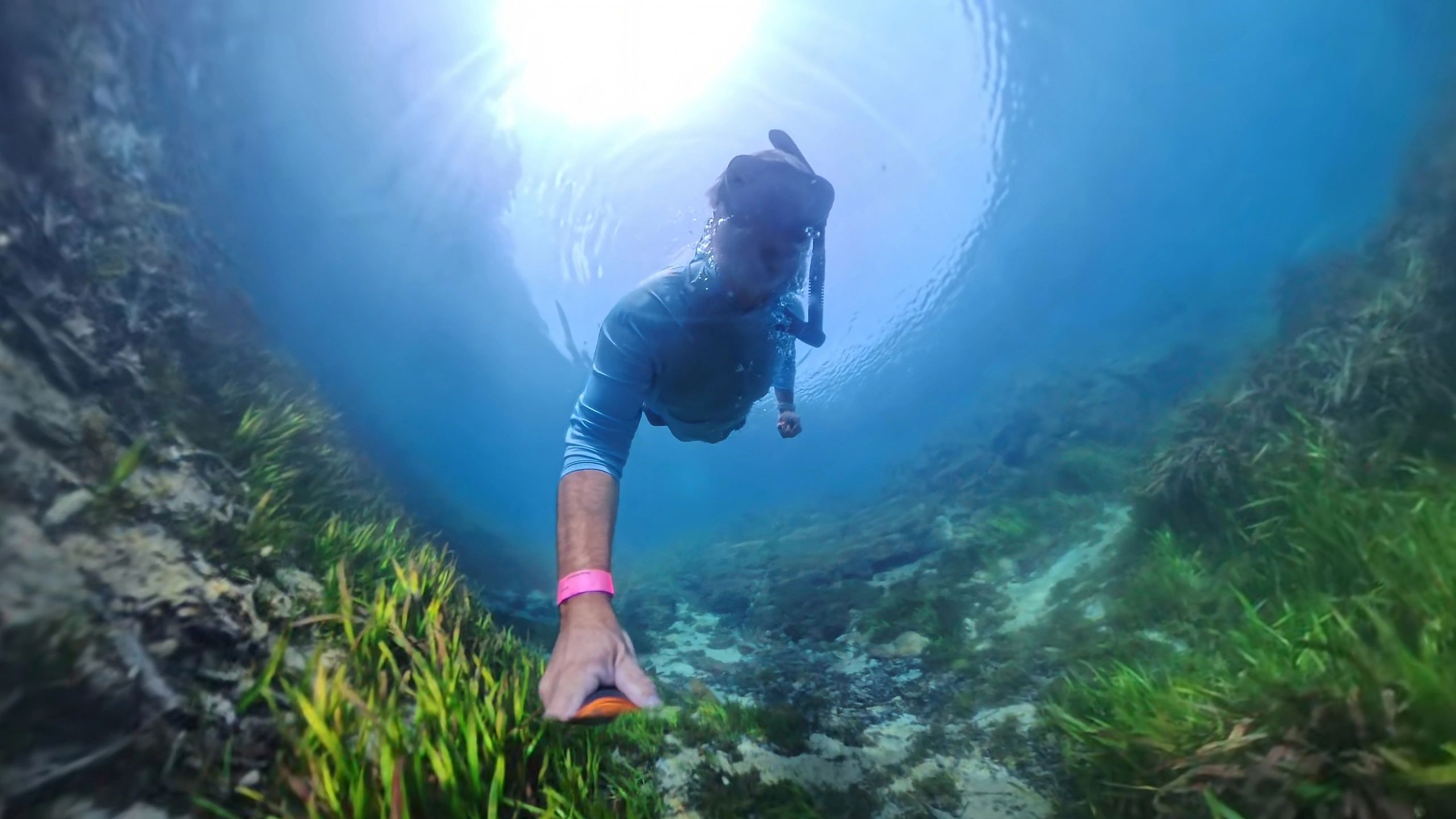 Scuba diver in narrow underwater canyon